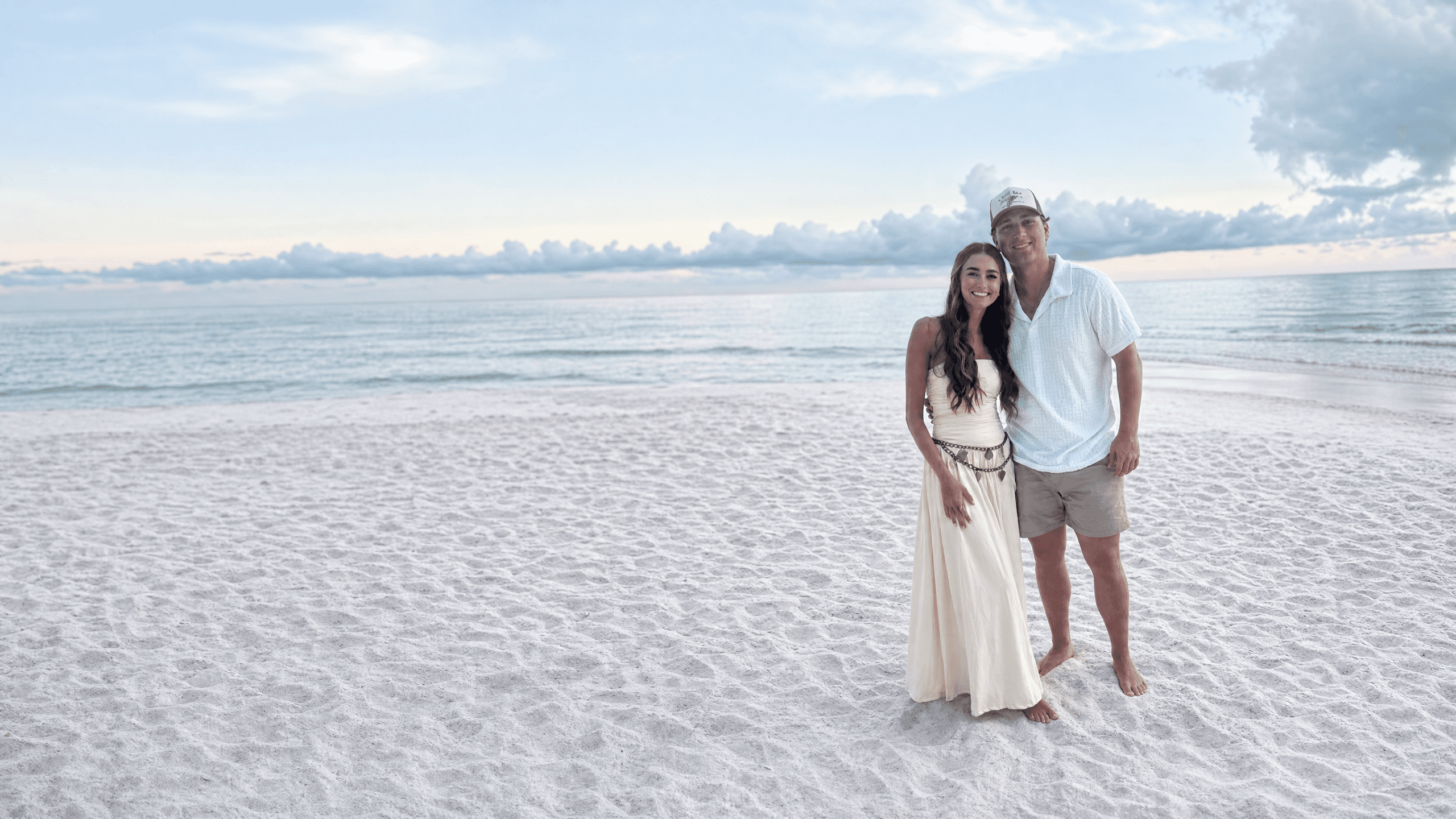 Elise and Tyler on the beach at golden hour